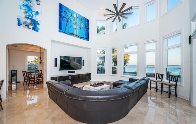 living room featuring a notable chandelier and crown molding