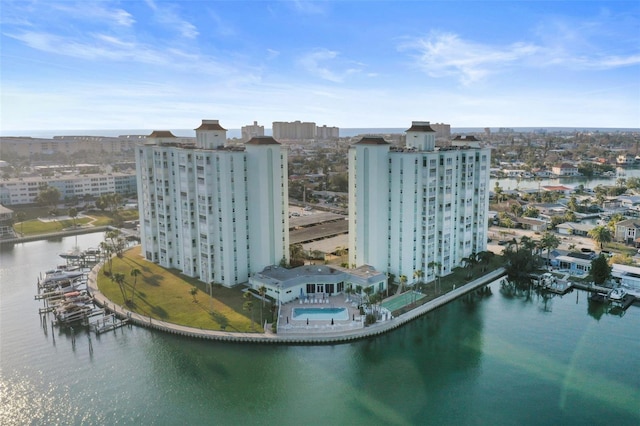 birds eye view of property with a water view