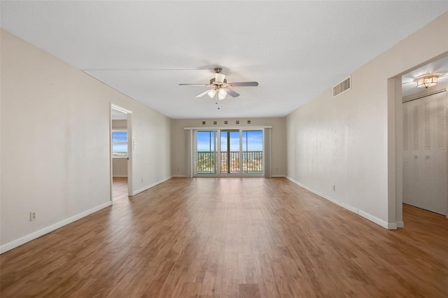 interior space featuring wood-type flooring and ceiling fan