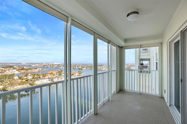 unfurnished sunroom with a water view