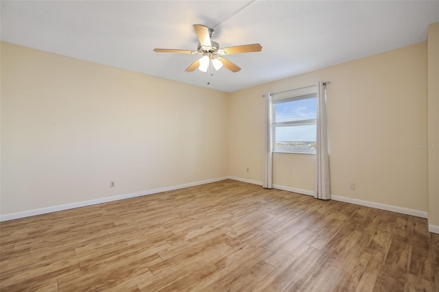 unfurnished room featuring ceiling fan and light wood-type flooring