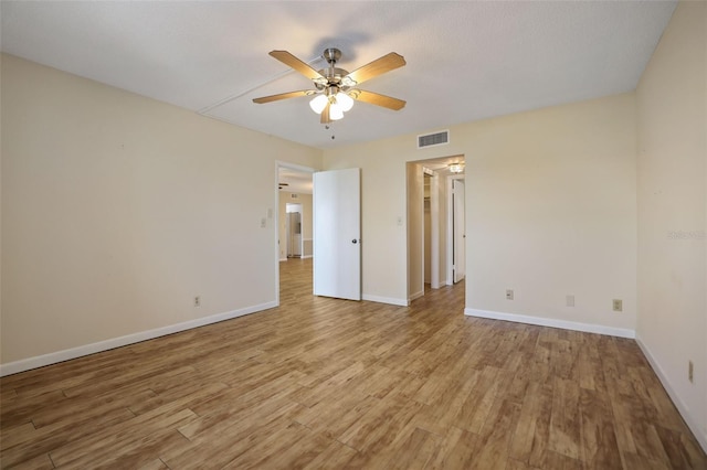 unfurnished room featuring light hardwood / wood-style floors and ceiling fan