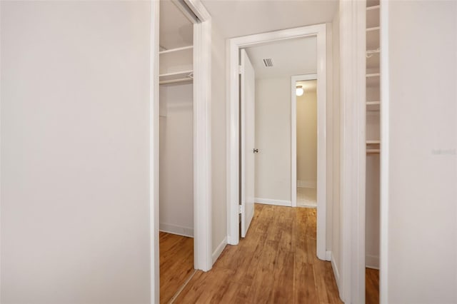 corridor featuring light hardwood / wood-style flooring