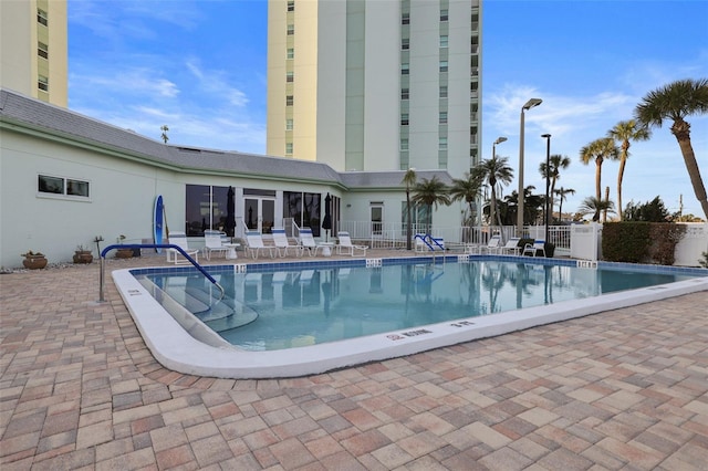 view of swimming pool with a patio area