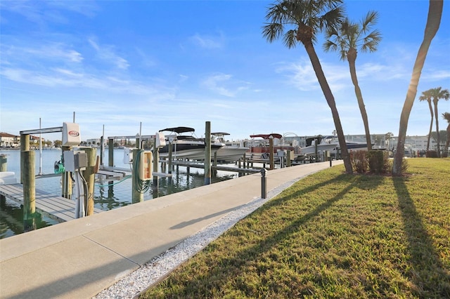 dock area featuring a yard and a water view