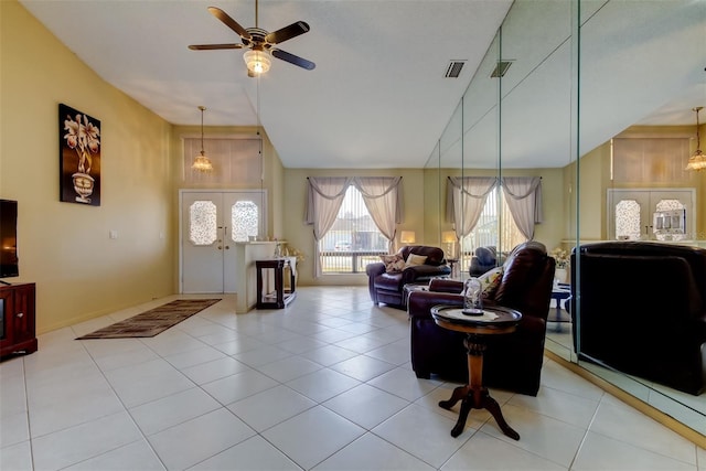 living room featuring high vaulted ceiling, tile patterned floors, french doors, and ceiling fan