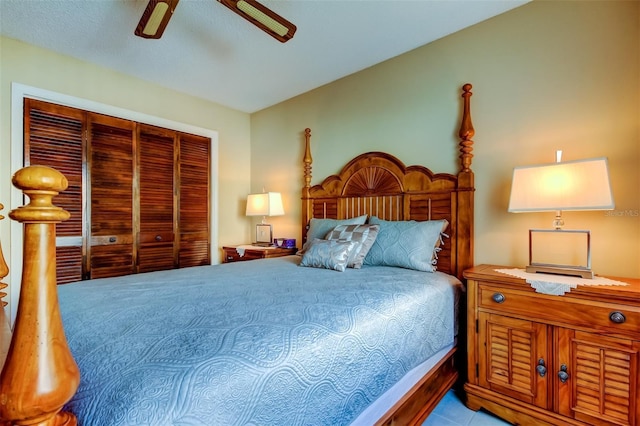 bedroom with ceiling fan and a closet