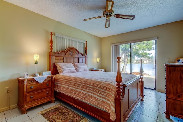 bedroom with access to exterior, light tile patterned floors, a textured ceiling, and ceiling fan