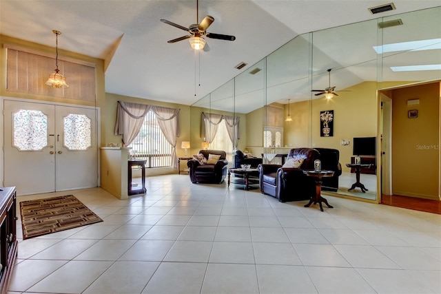 entryway featuring light tile patterned flooring, visible vents, and ceiling fan