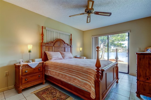 bedroom with access to exterior, light tile patterned floors, a textured ceiling, and a ceiling fan