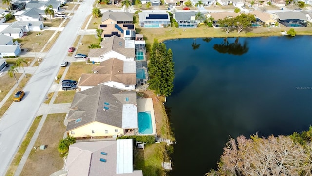 birds eye view of property featuring a residential view and a water view