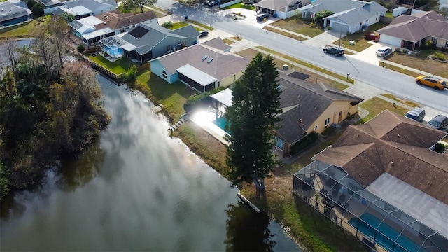 bird's eye view featuring a residential view and a water view