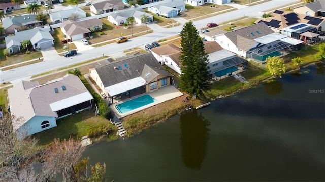 bird's eye view featuring a residential view and a water view