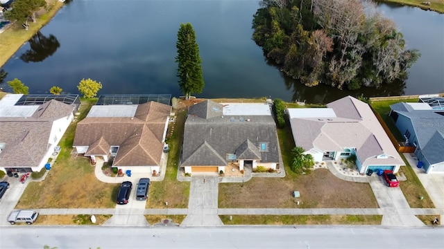 birds eye view of property with a residential view and a water view