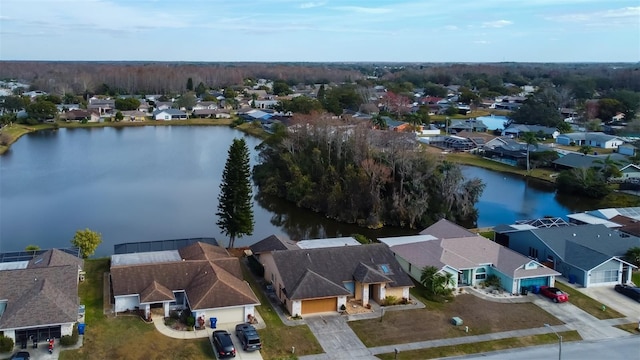 bird's eye view featuring a residential view and a water view