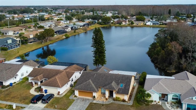 birds eye view of property featuring a residential view and a water view