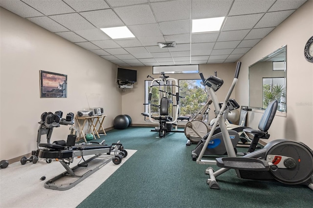 gym featuring a paneled ceiling