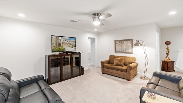 living room featuring ceiling fan and light colored carpet