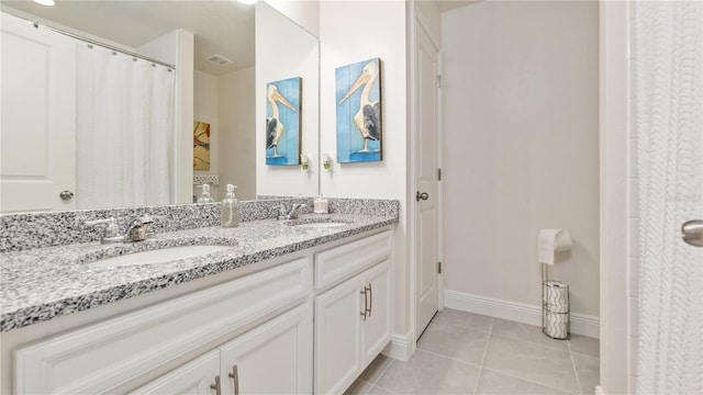 bathroom with vanity and tile patterned flooring