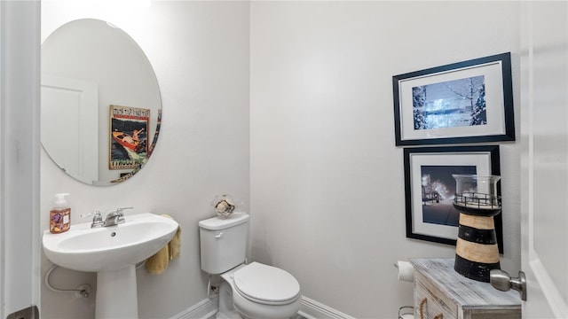 bathroom featuring toilet and sink