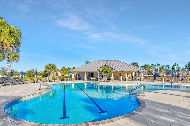 view of swimming pool with a patio area