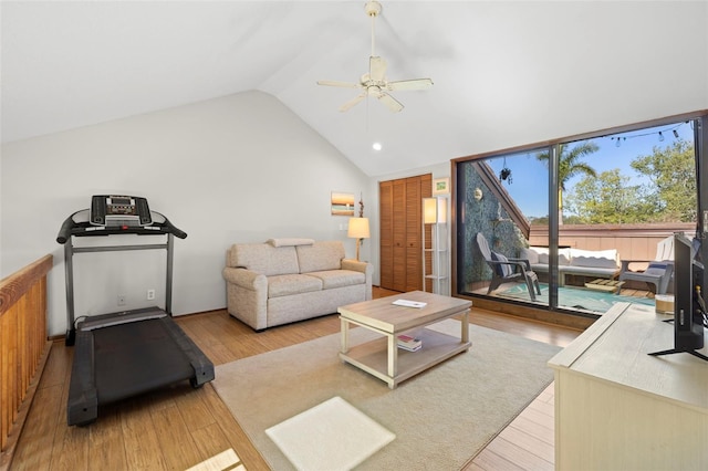 living room with vaulted ceiling, ceiling fan, and light hardwood / wood-style floors