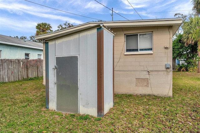 view of outdoor structure with a lawn