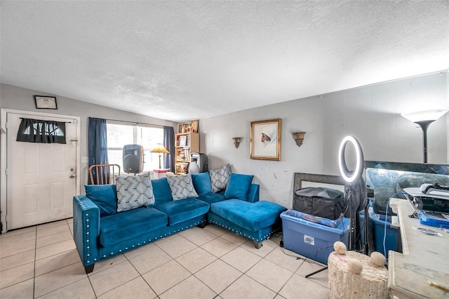 living room featuring light tile patterned flooring and a textured ceiling