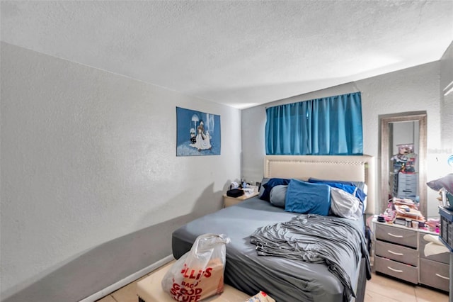 bedroom featuring a textured ceiling