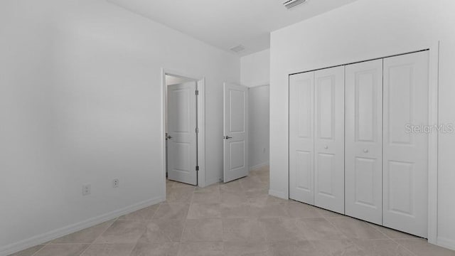 unfurnished bedroom featuring a closet