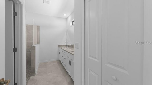 bathroom featuring vanity and walk in shower