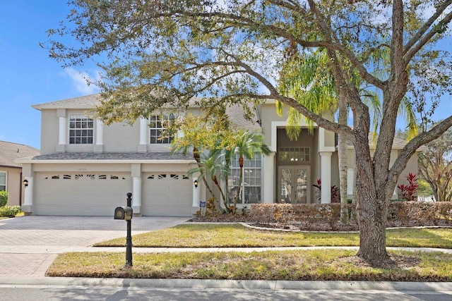 view of front of home featuring a garage and a front yard