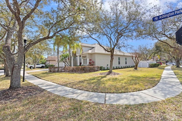 view of side of property featuring a yard