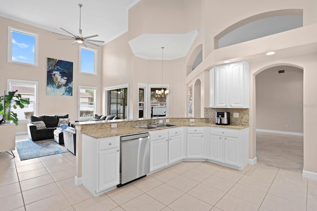 kitchen with white cabinetry, dishwasher, kitchen peninsula, and light tile patterned floors