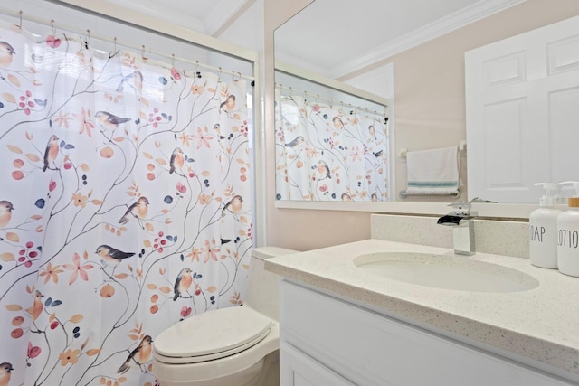 bathroom featuring a shower with curtain, ornamental molding, vanity, and toilet