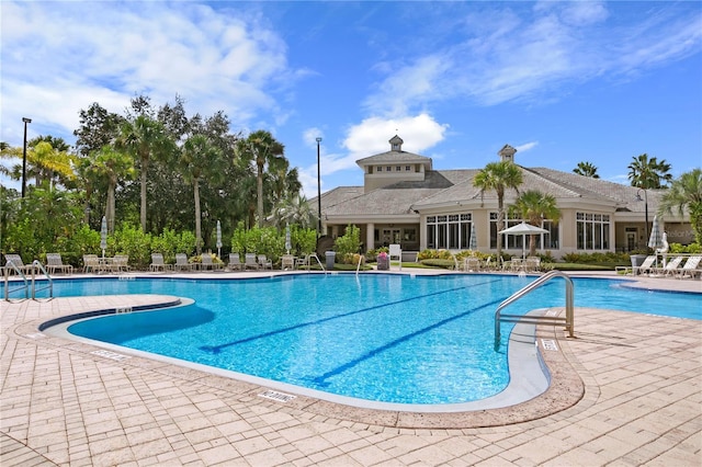 view of swimming pool with a patio