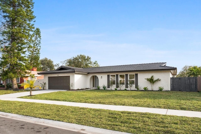 single story home with a garage and a front lawn