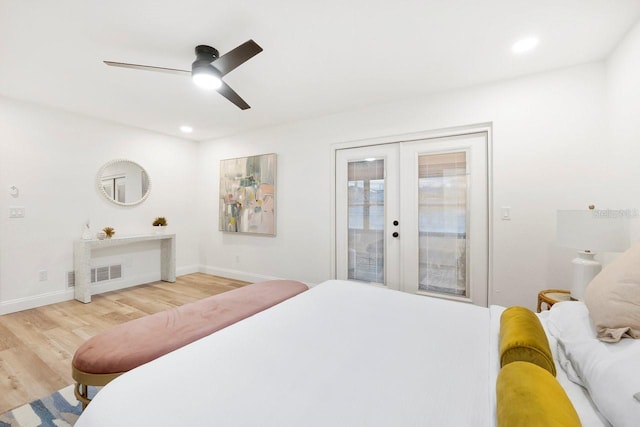 bedroom with access to exterior, hardwood / wood-style flooring, french doors, and ceiling fan