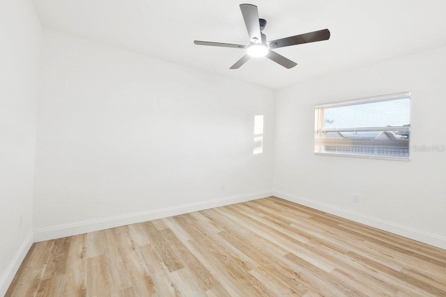 empty room featuring ceiling fan and light wood-type flooring