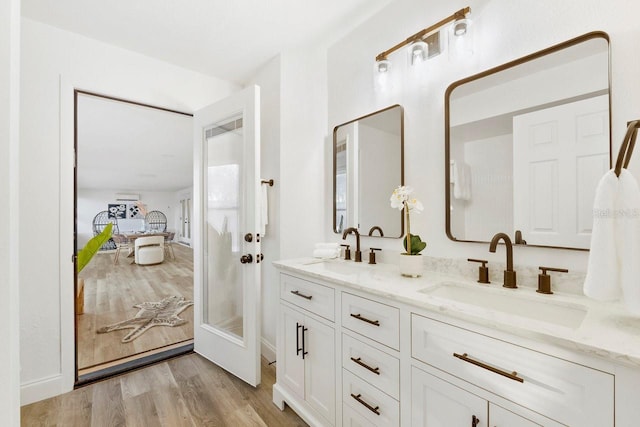 bathroom featuring wood-type flooring and vanity