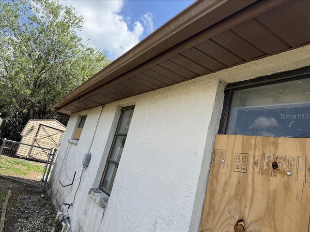 details with stucco siding and fence