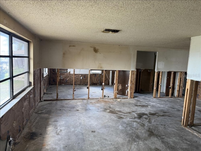miscellaneous room with a textured ceiling and visible vents