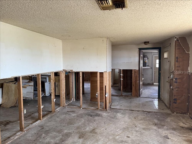 miscellaneous room featuring visible vents and a textured ceiling