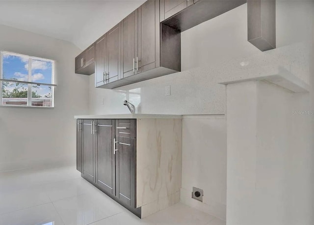 laundry area with cabinets and hookup for an electric dryer