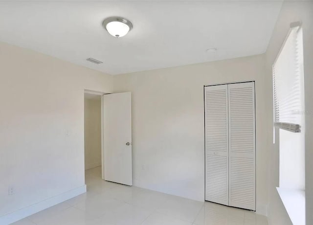 unfurnished bedroom featuring a closet