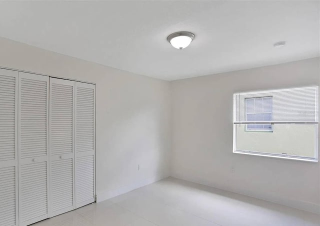 unfurnished bedroom with a closet