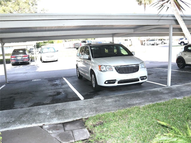 view of vehicle parking with a carport