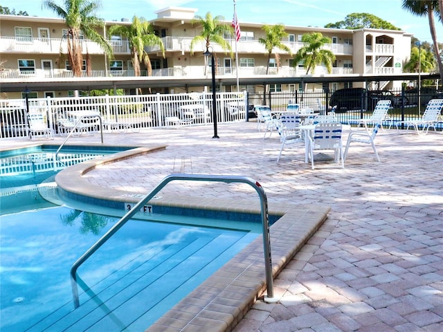 view of swimming pool with a patio