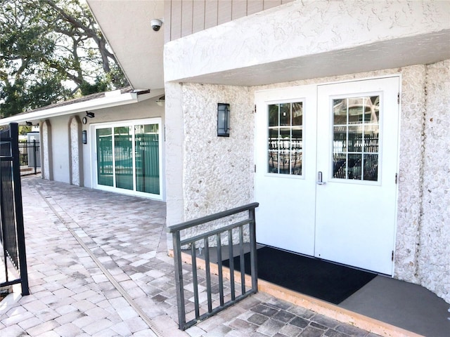 property entrance with a patio