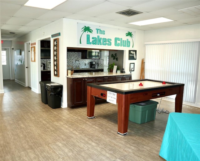 game room featuring a drop ceiling